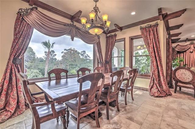 dining space with baseboards, recessed lighting, a notable chandelier, and ornamental molding