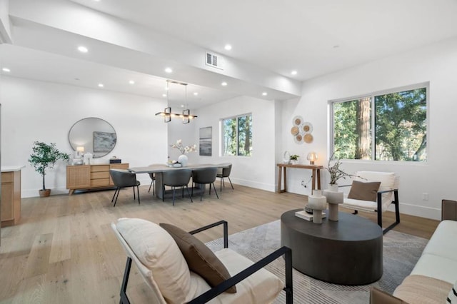 living room with light hardwood / wood-style floors