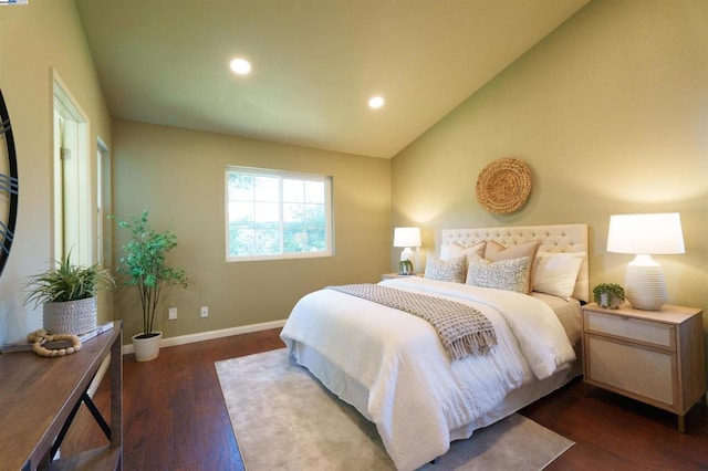 bedroom featuring lofted ceiling and dark hardwood / wood-style floors