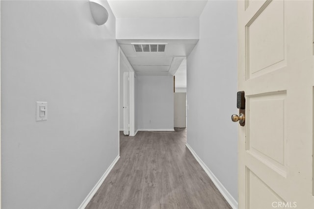 corridor with light wood-type flooring