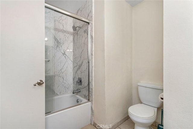 bathroom with shower / bath combination with glass door and toilet