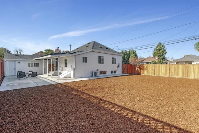 rear view of property with a patio area