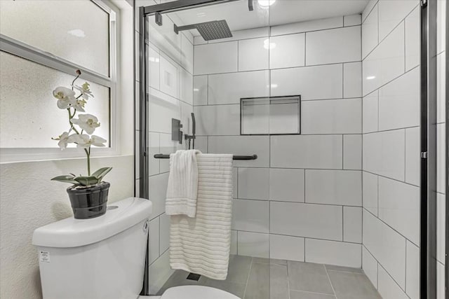 bathroom with toilet and walk in shower