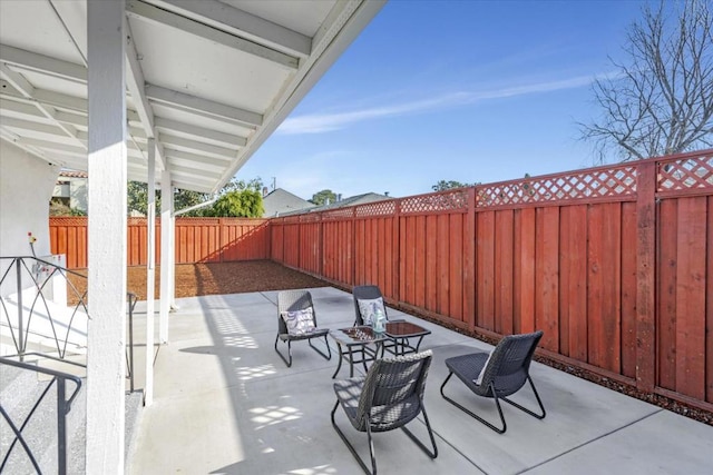 view of patio with an outdoor fire pit