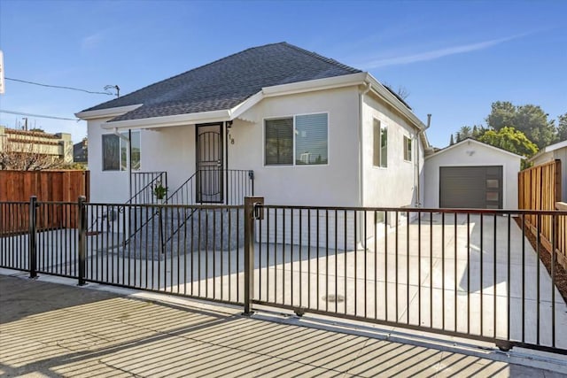 view of front of home featuring an outbuilding and a garage