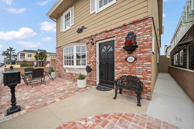 property entrance featuring a patio