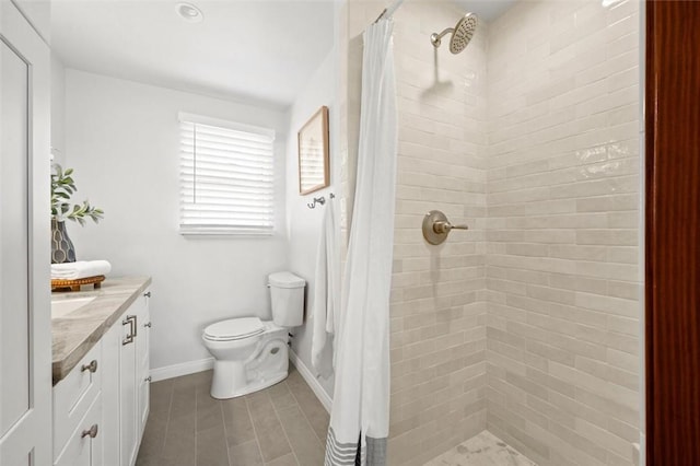 bathroom featuring curtained shower, toilet, and vanity