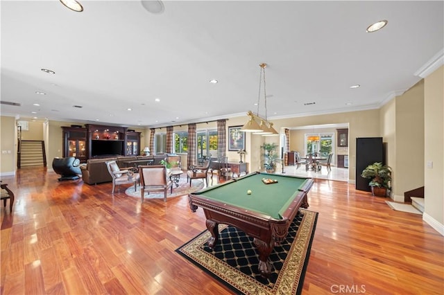 game room featuring a wealth of natural light, crown molding, light hardwood / wood-style flooring, and billiards