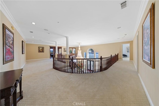 corridor featuring light carpet and crown molding