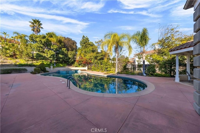 view of swimming pool featuring a patio