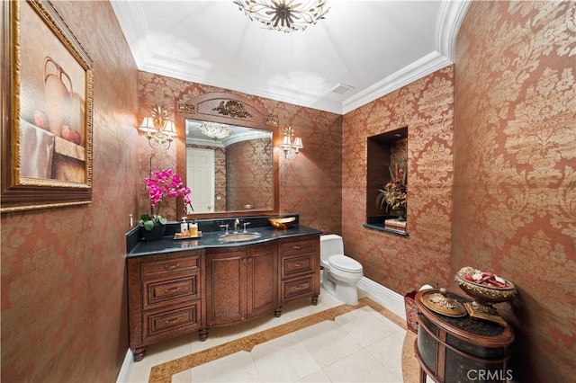 bathroom with toilet, ornamental molding, tile patterned flooring, and vanity