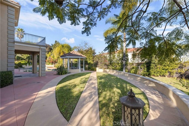 view of home's community featuring a gazebo and a lawn