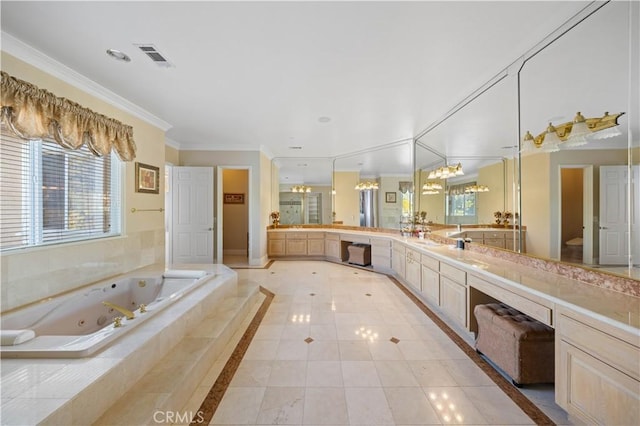 bathroom featuring tiled tub, tile patterned floors, vanity, and ornamental molding