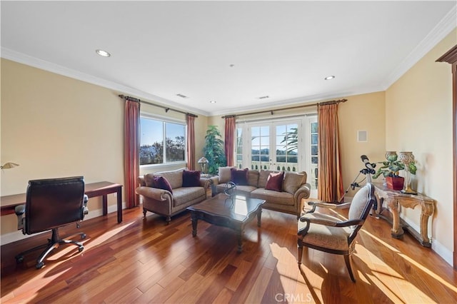 living room with wood-type flooring and crown molding