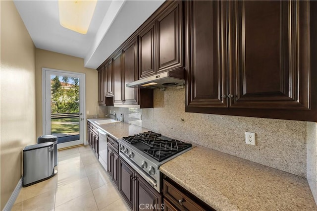 kitchen with dishwasher, backsplash, stainless steel gas cooktop, light tile patterned flooring, and dark brown cabinets