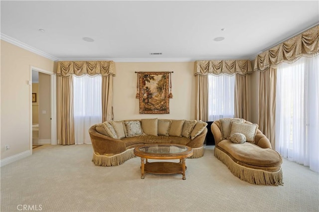 sitting room with light colored carpet and ornamental molding