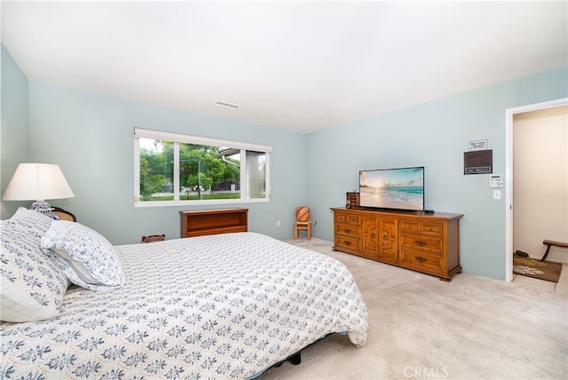 bedroom with light carpet