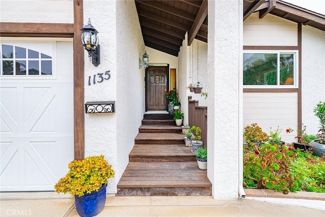 doorway to property featuring a garage