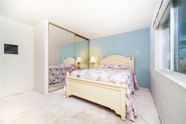 bedroom with a closet and carpet flooring