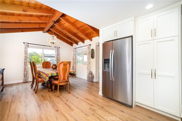 dining area featuring light wood-type flooring, lofted ceiling with beams, a chandelier, and wooden ceiling