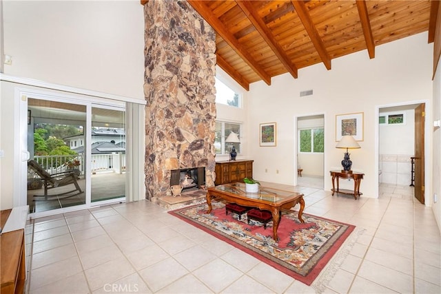 living room with high vaulted ceiling, light tile patterned floors, wood ceiling, and beam ceiling