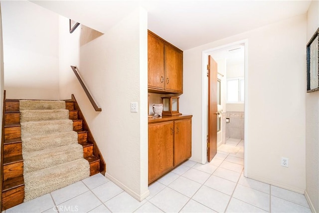 corridor featuring light tile patterned flooring