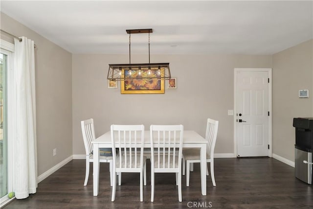 dining space featuring dark hardwood / wood-style flooring