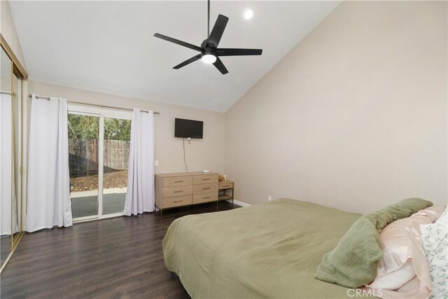 bedroom featuring ceiling fan, dark hardwood / wood-style floors, high vaulted ceiling, and access to outside