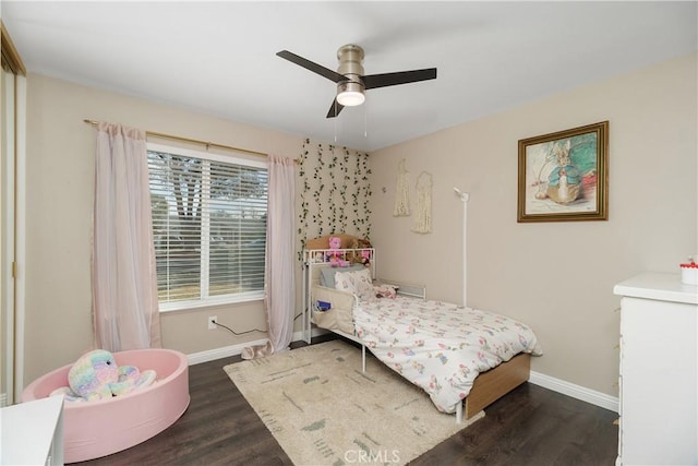 bedroom featuring dark wood-type flooring and ceiling fan