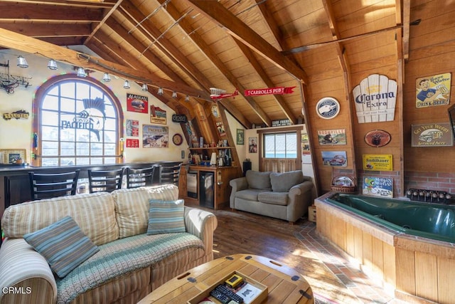 living room with a bar, vaulted ceiling with beams, wooden ceiling, and wood finished floors