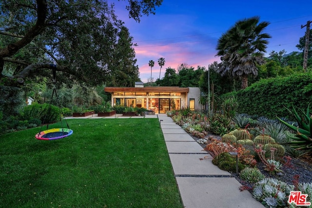 view of front of house with a lawn