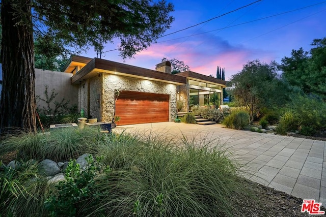 view of front of home with a garage