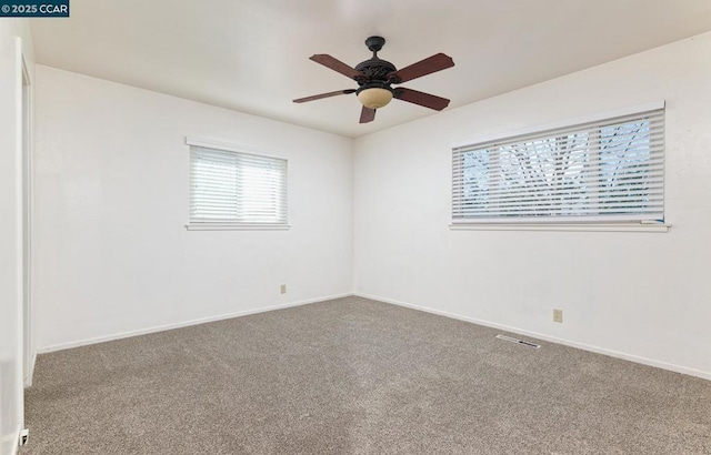 unfurnished room featuring carpet floors and ceiling fan