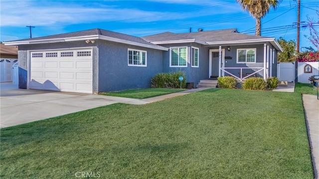 ranch-style house featuring a garage and a front yard