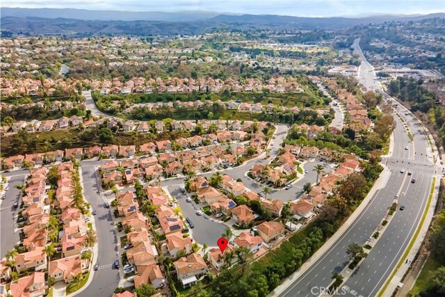 birds eye view of property with a mountain view