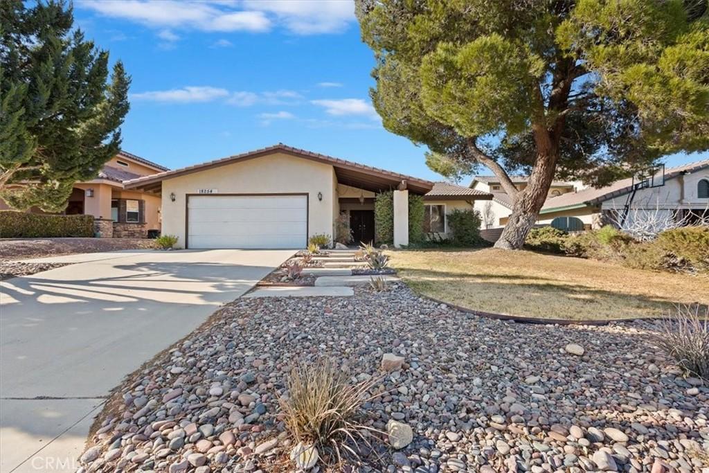 single story home featuring a garage