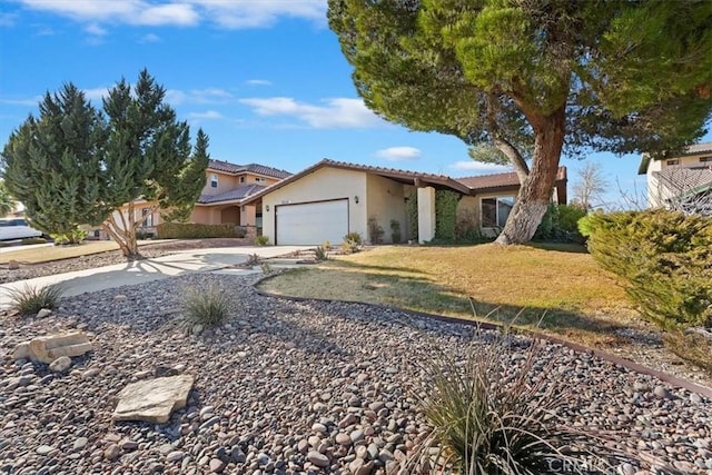 view of front of home with a front lawn and a garage