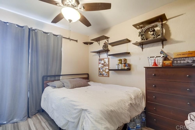 bedroom featuring ceiling fan and wood finished floors