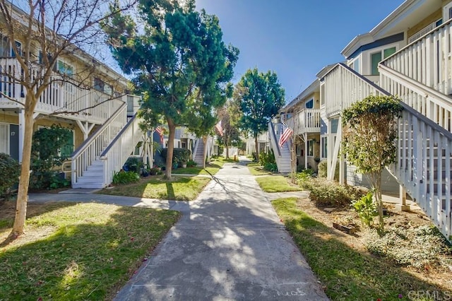 view of community with a residential view and stairs