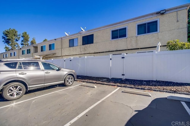 uncovered parking lot with fence