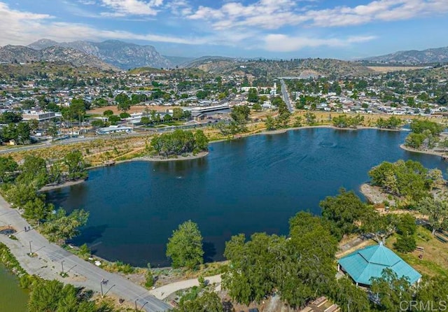 bird's eye view with a water and mountain view