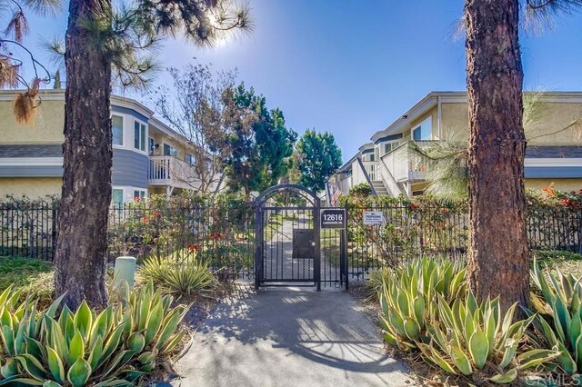 view of gate with fence