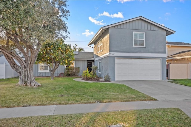 view of front property with a garage and a front yard