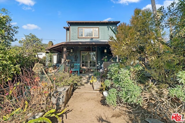 view of front of property with a porch and french doors