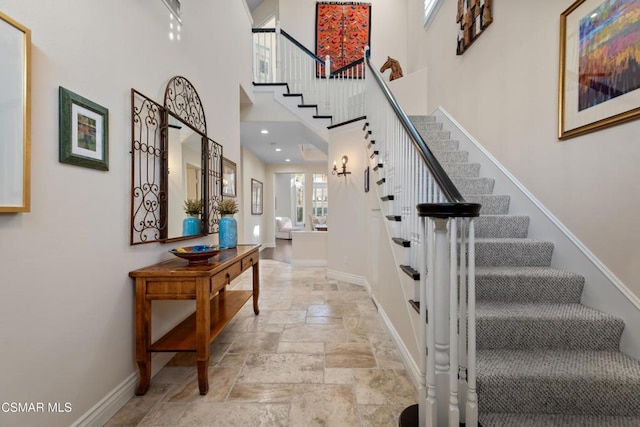 entrance foyer featuring a towering ceiling