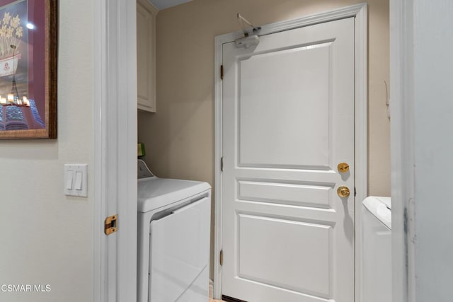 laundry area with cabinets and separate washer and dryer