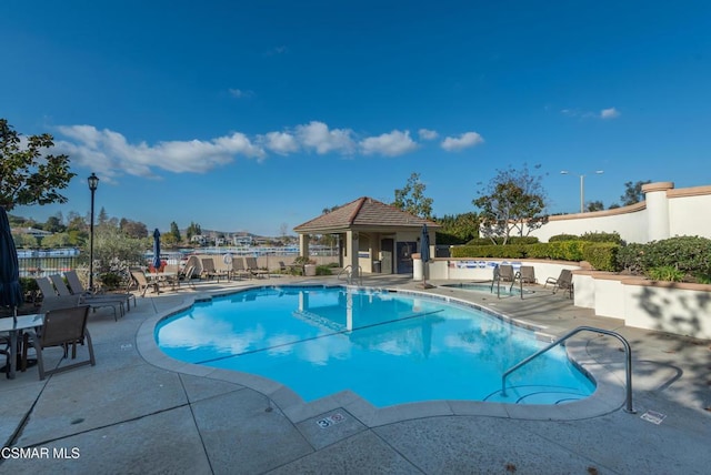 view of swimming pool featuring a patio