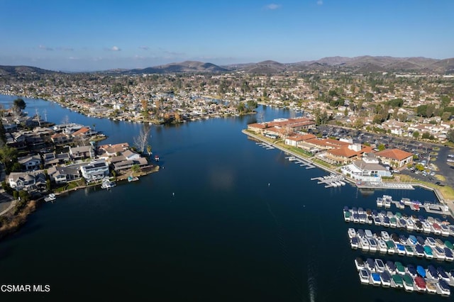 drone / aerial view with a water and mountain view