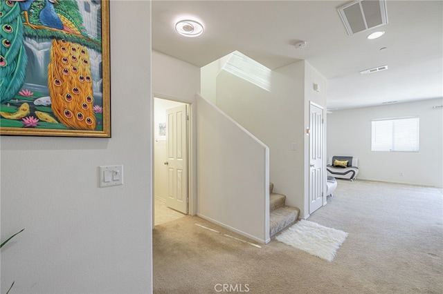 hallway with light colored carpet