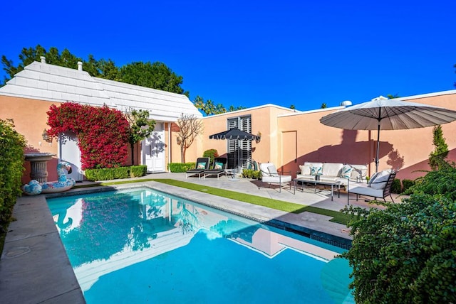 view of swimming pool with an outdoor hangout area and a patio